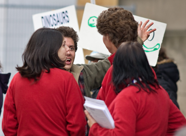dino_protest_23 Agent Showup explains what D.I.N.O believes in, to the ROM staff
